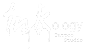 A black and white logo of a tattoo shop.
