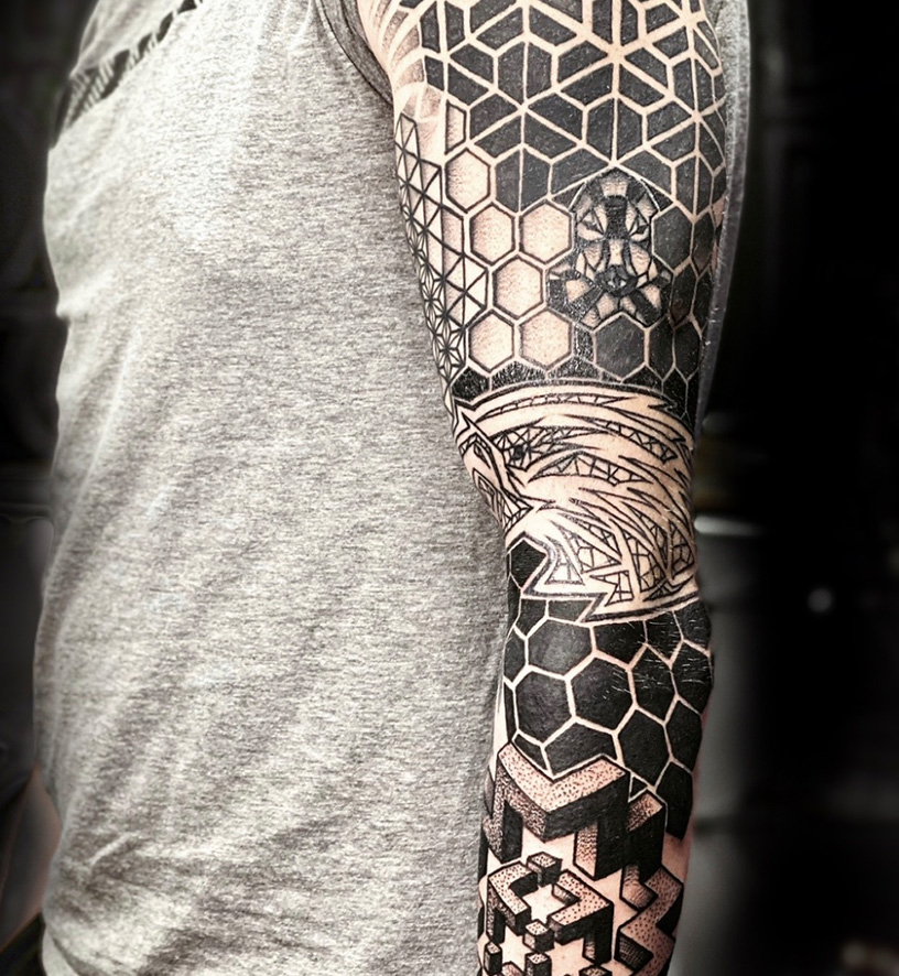 A man with a tattoo on his arm.