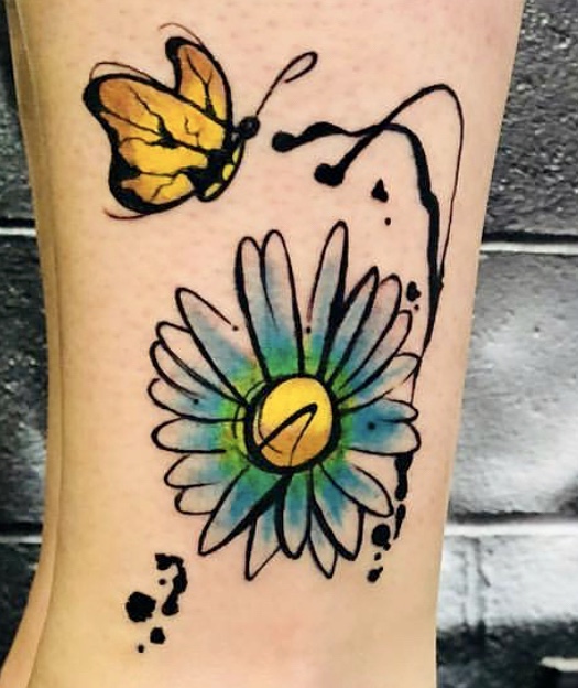 A tattoo of a flower and butterfly on the arm.