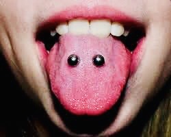 A person with their tongue out and has a pig face on it.