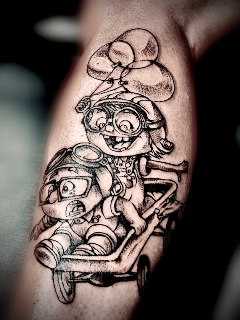A tattoo of a girl and boy in a carriage.
