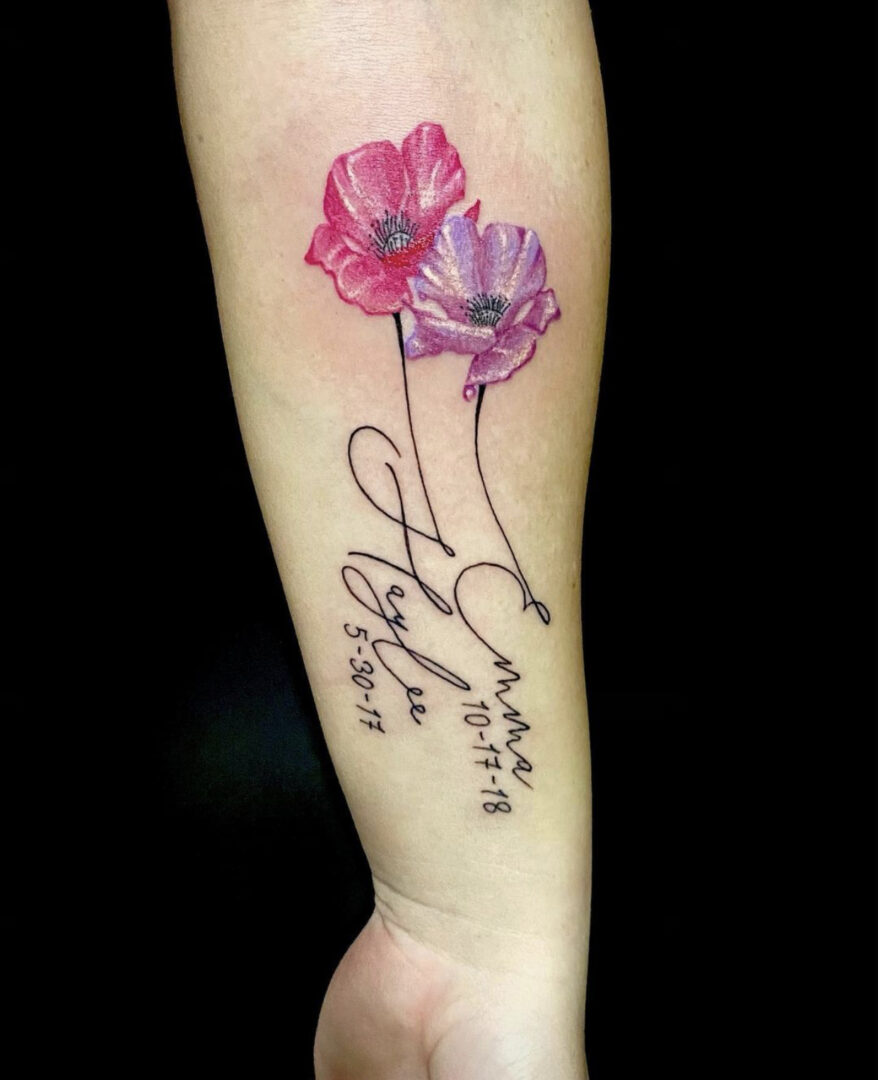 A tattoo of two flowers with the name 
