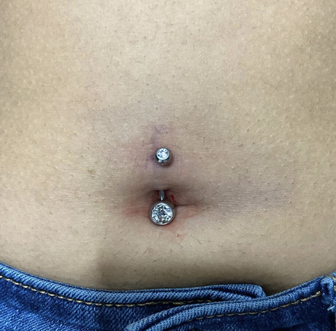 A woman with an upside down belly button piercing.