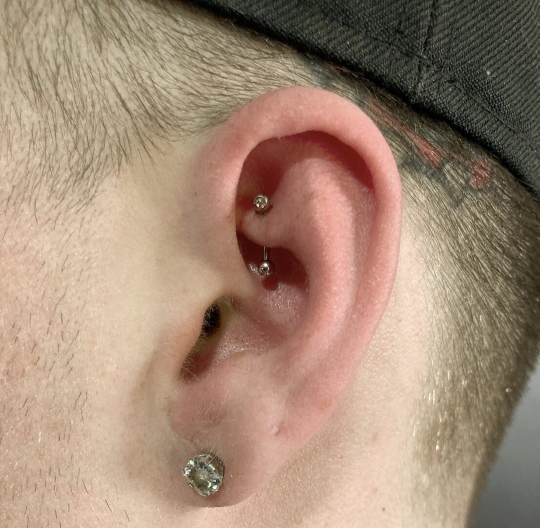 A man with a piercing in his ear.