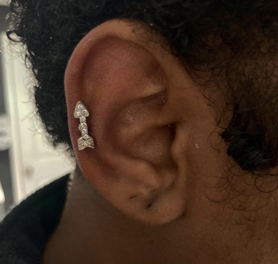 A woman with a piercing in her ear.