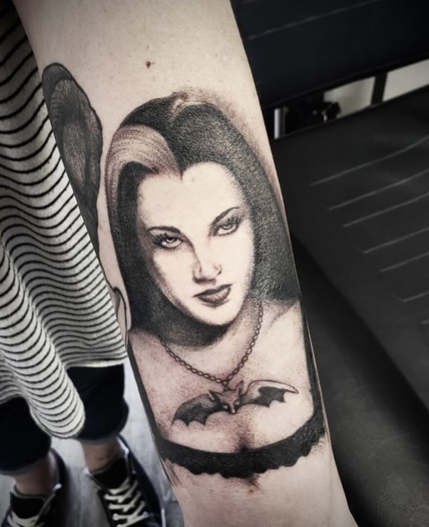 A woman with bat tattoo on arm