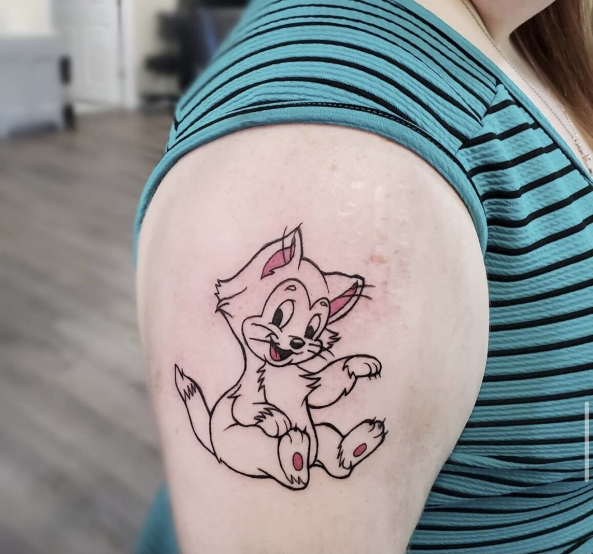 A woman with a tattoo of a dog on her arm.