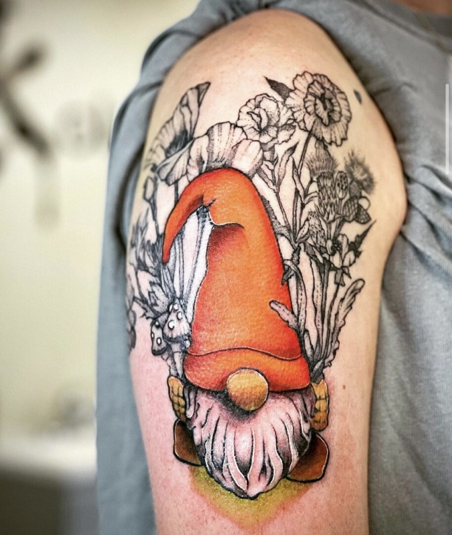 A gnome tattoo on the arm of someone.