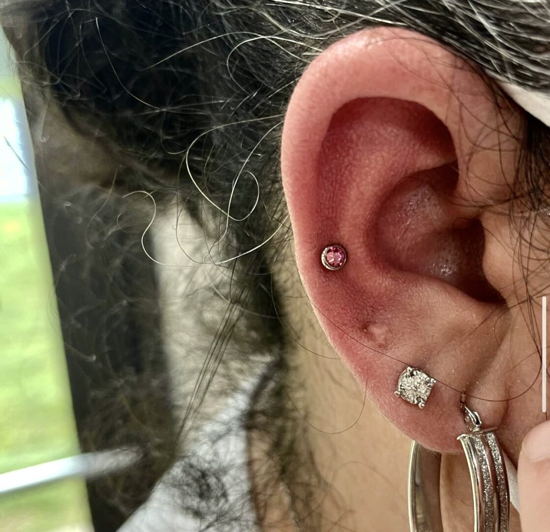 A woman with a piercing in her ear.