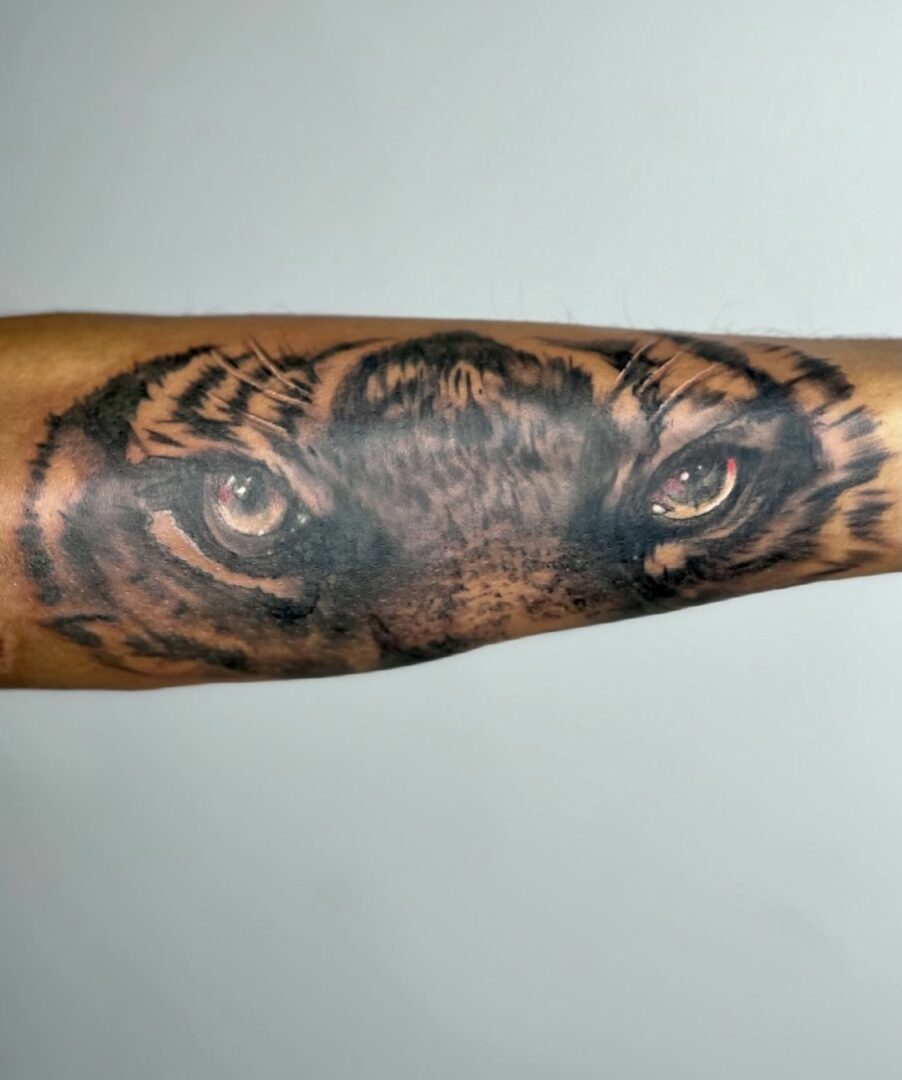 A tattoo of an eye on the arm.