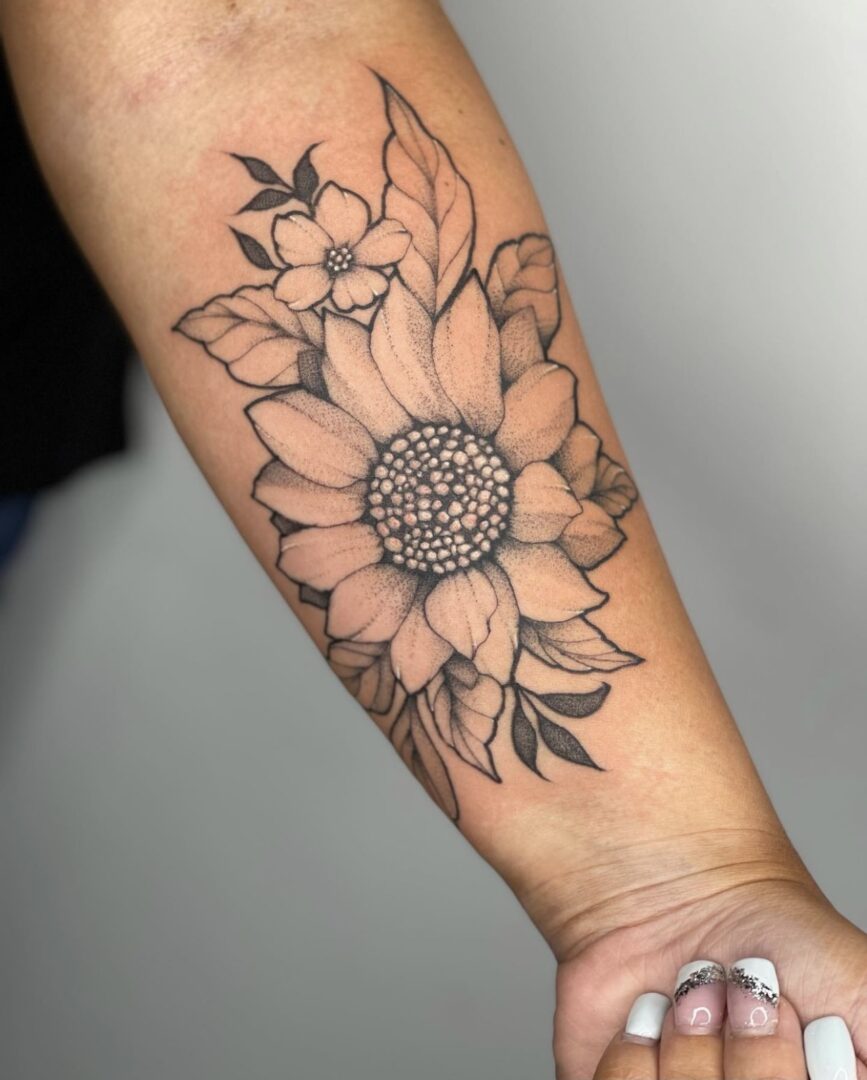 A tattoo of flowers on the arm