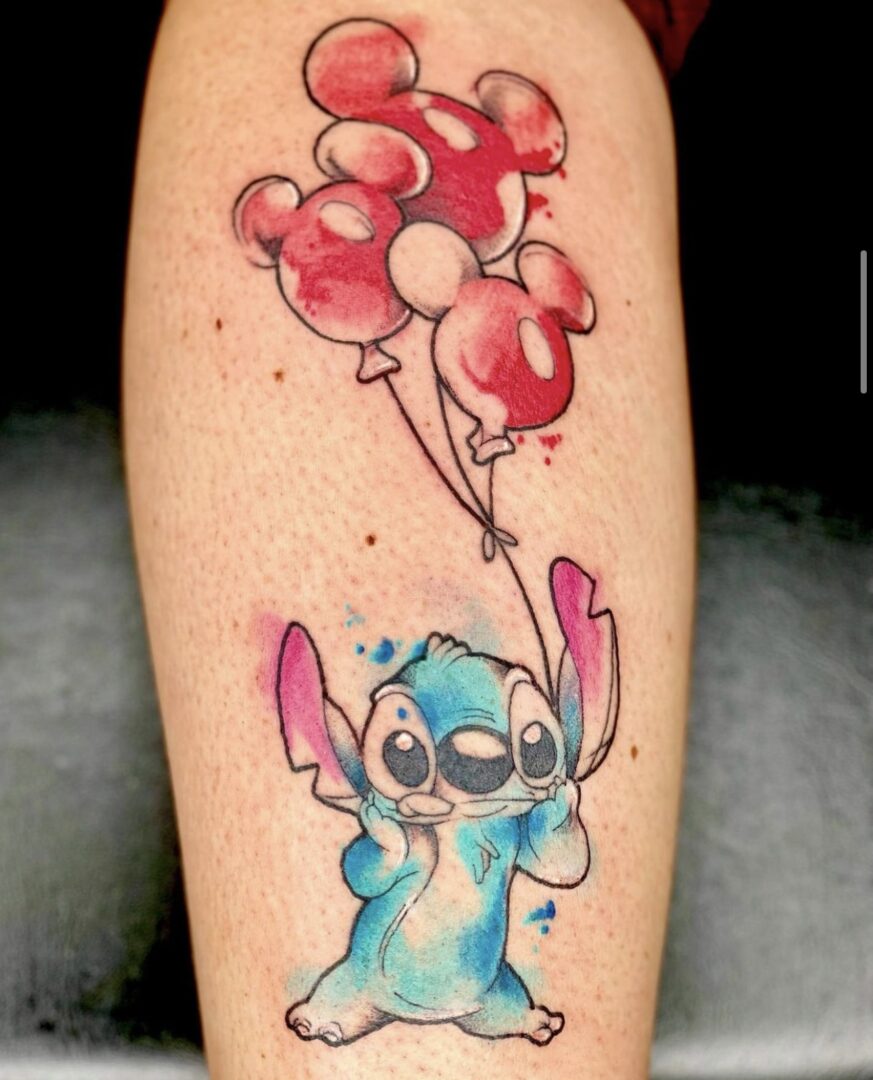 A tattoo of stitch holding balloons is shown.