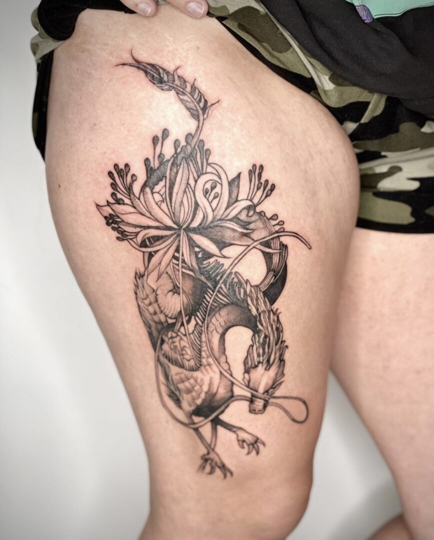 A woman with a tattoo on her leg.