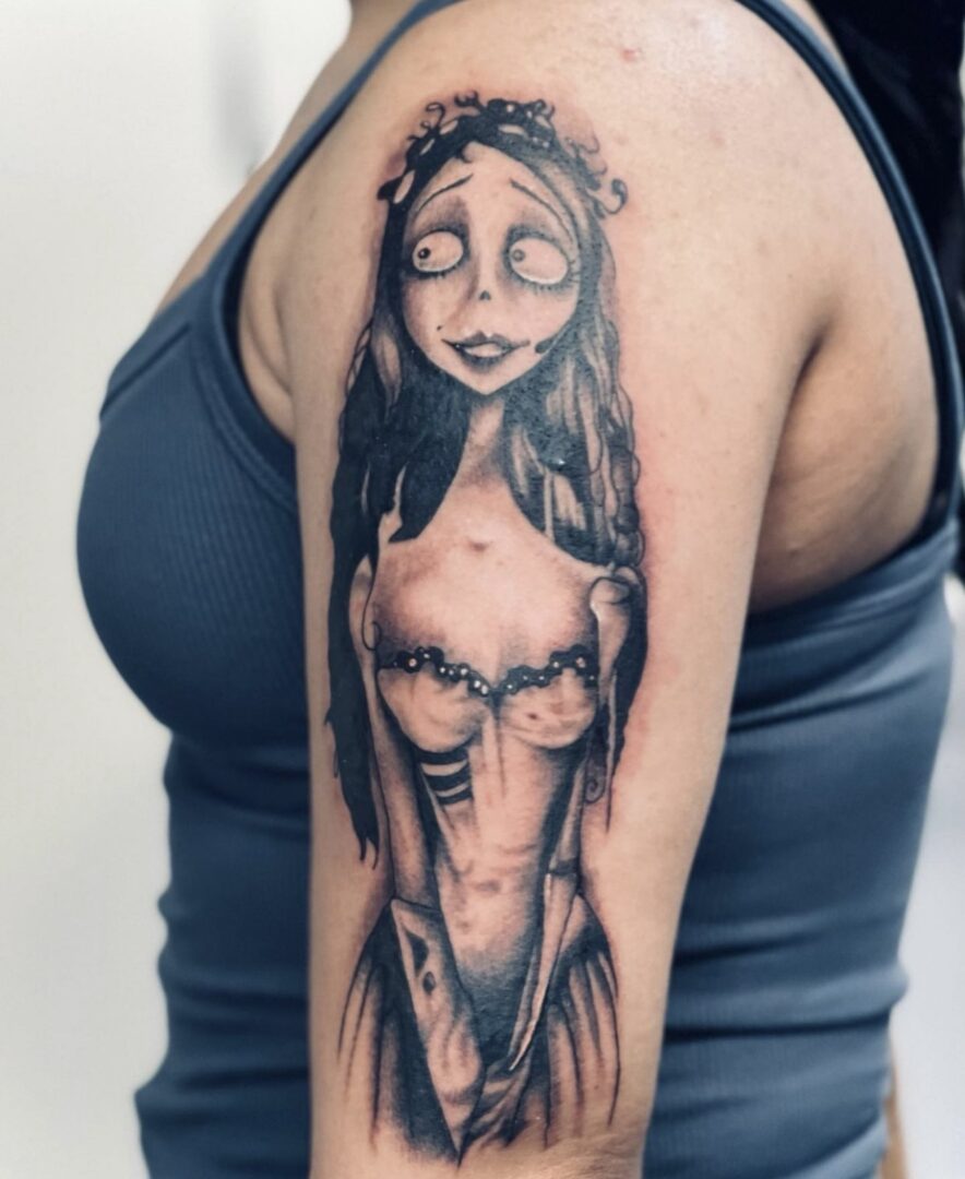 A woman with a tattoo on her arm.