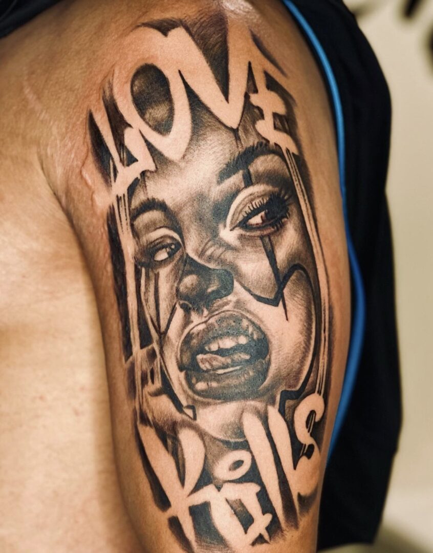 A man with a tattoo of a crying face.