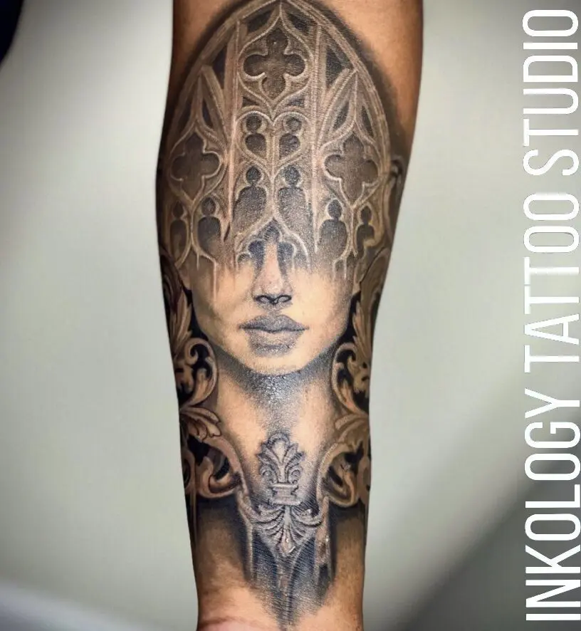 A tattoo of a woman 's face with intricate design.